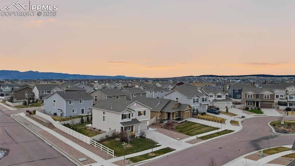 Image 2 of 50: Corner cul-de-sac lot with split rail fencing and beautiful low maintenance