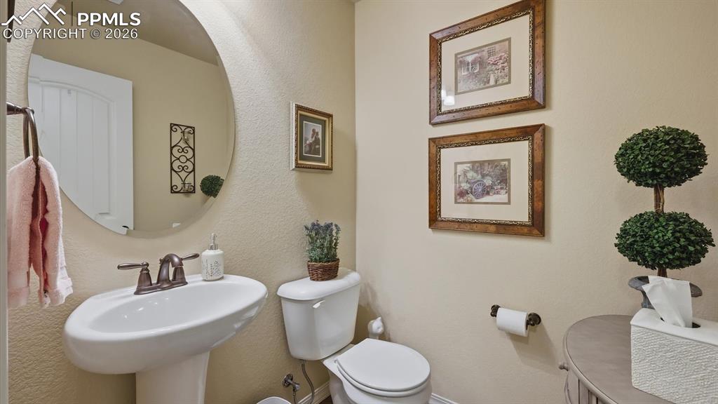 Image 9 of 50: Convenient main level Powder Bathroom.