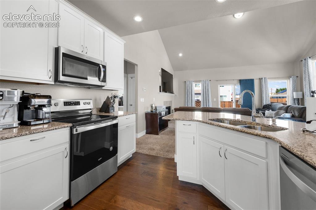 Image 15 of 40: Granite countertops and stainless appliances are included