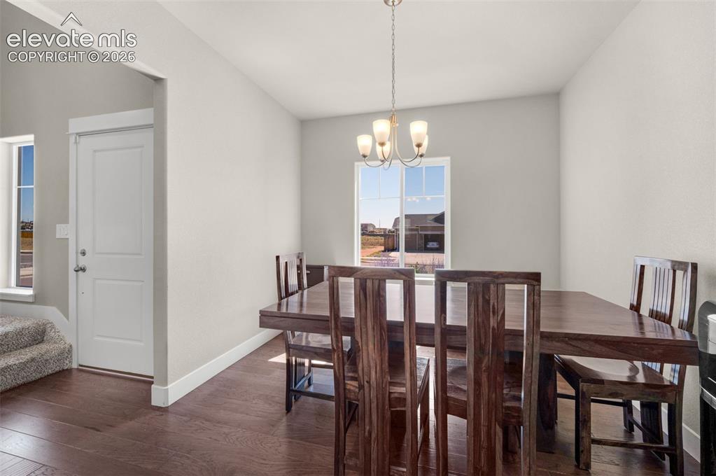 Image 17 of 40: Formal dining area looks out to front yard