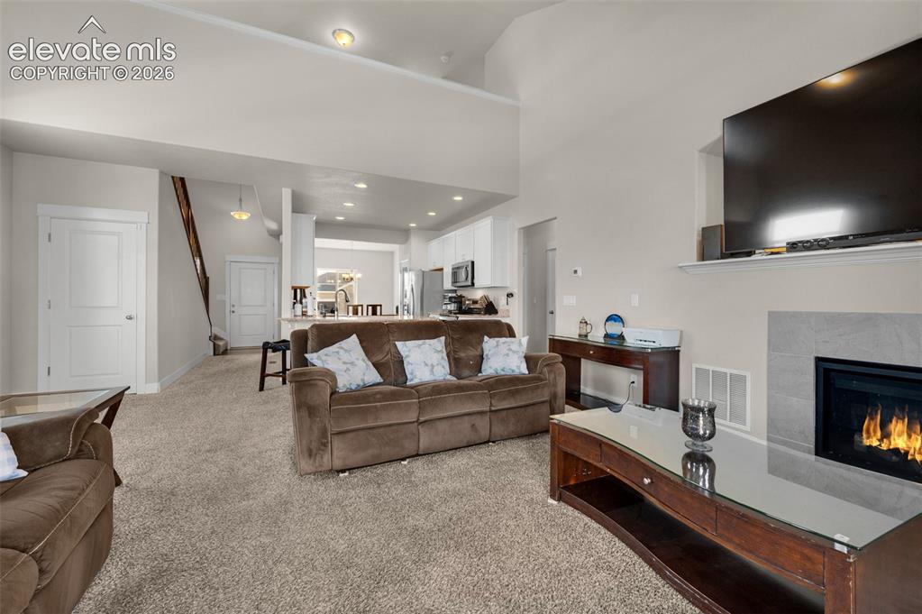 Image 8 of 40: From the living room you can look up to the loft