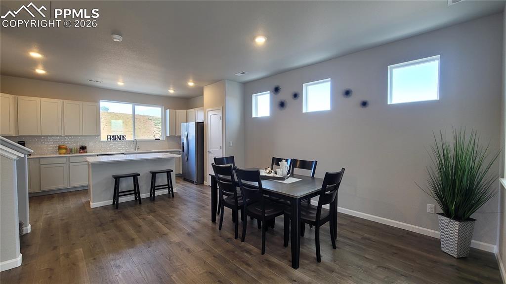 Image 12 of 28: Host a meal in this dining area!