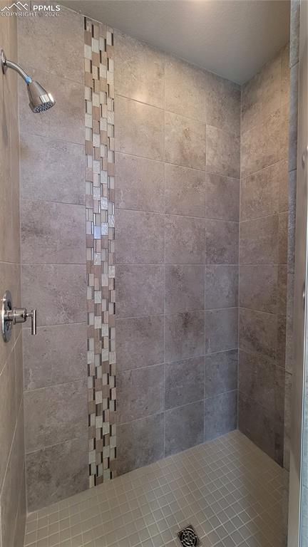 Image 21 of 28: Primary Shower with Tile Surround!