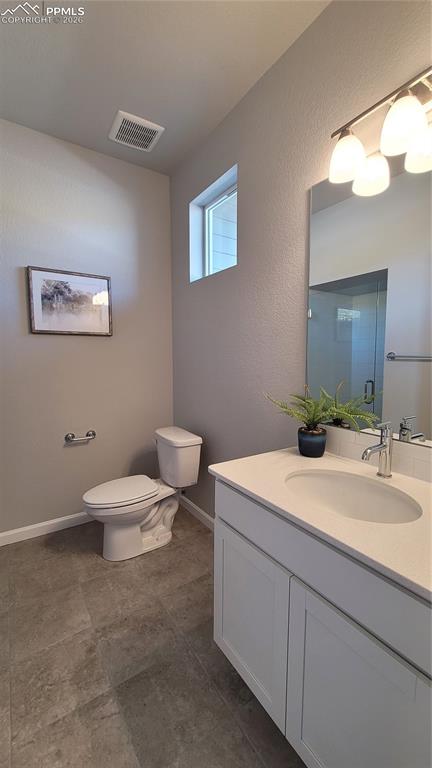 Image 5 of 28: 3/4 Bathroom with Quartz countertop and tile surround!