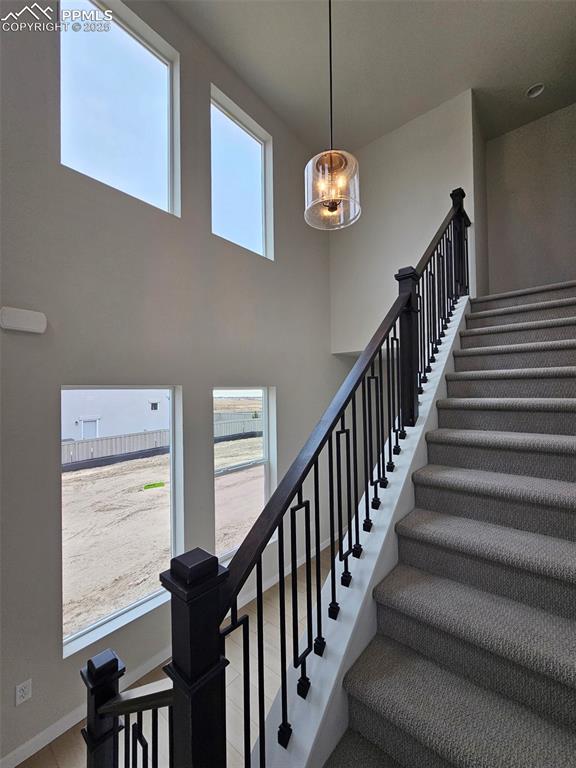 Image 3 of 24: Stairs to upper level