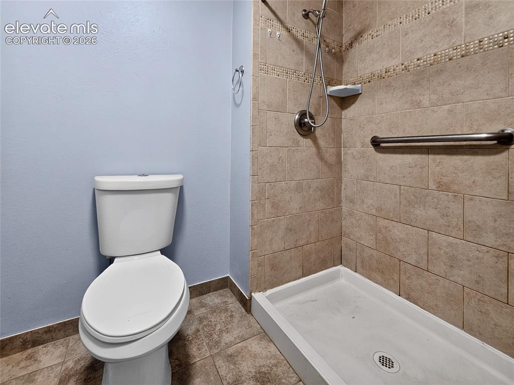 Image 13 of 27: Separate shower and toilet in primary bedroom. 