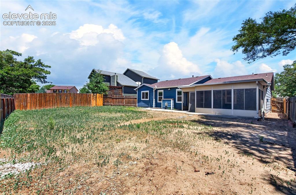 Image 26 of 27: Large flat backyard ready for your touches