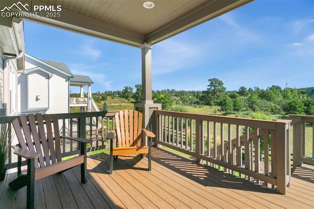 Image 47 of 50: Deck with view of wooded area