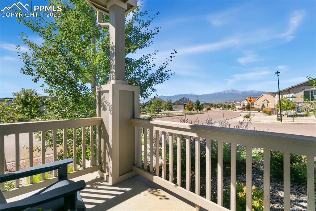 Image 9 of 50: Balcony featuring a residential view and a mountain view