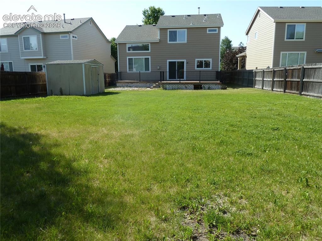 Image 4 of 18: Great amount of room for play, gardening, storage shed for the extras.