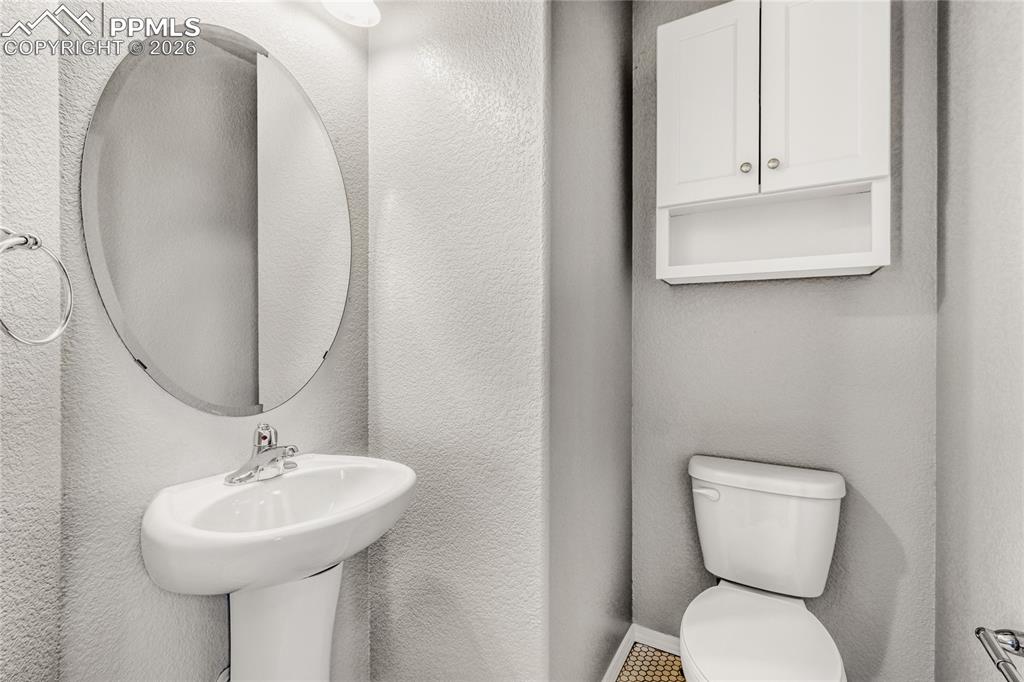 Image 15 of 34: Bathroom with toilet and sink