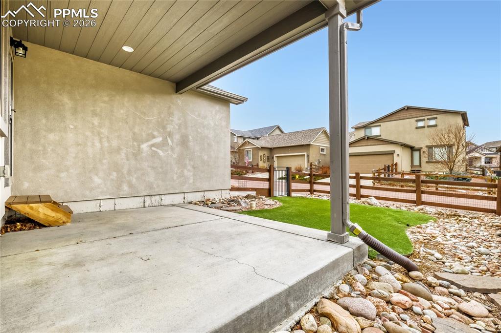 Image 27 of 34: View of patio with a residential view