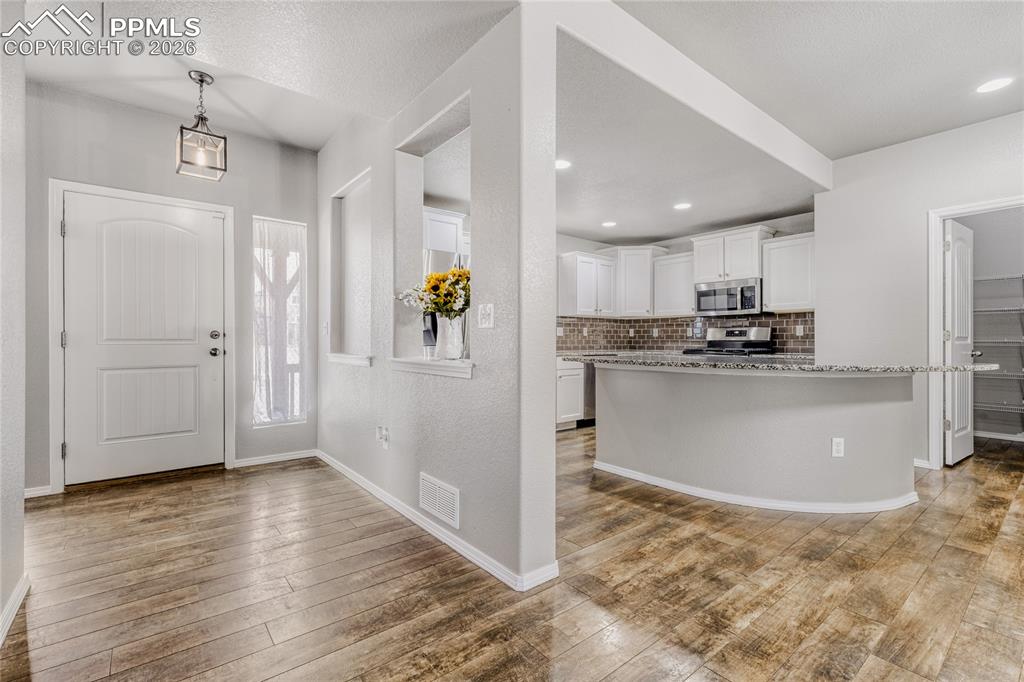 Image 5 of 34: Entrance foyer with LVP flooring