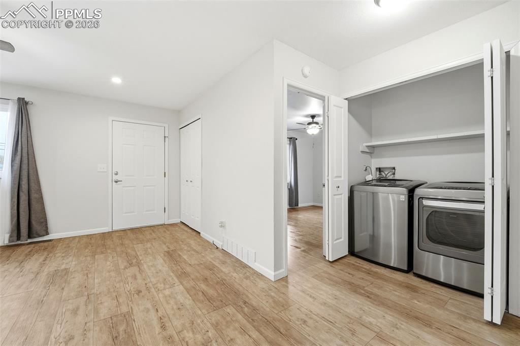 Image 12 of 24: First level laundry with utility shelf. 