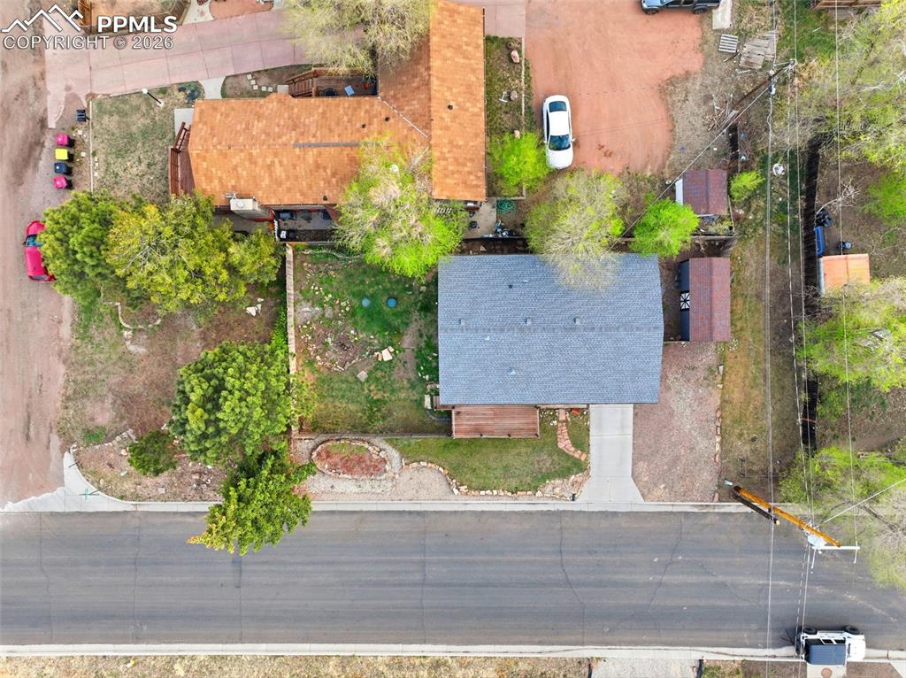 Image 6 of 24: Drone shot of property showcasing the additional lot on the corner of S Pin