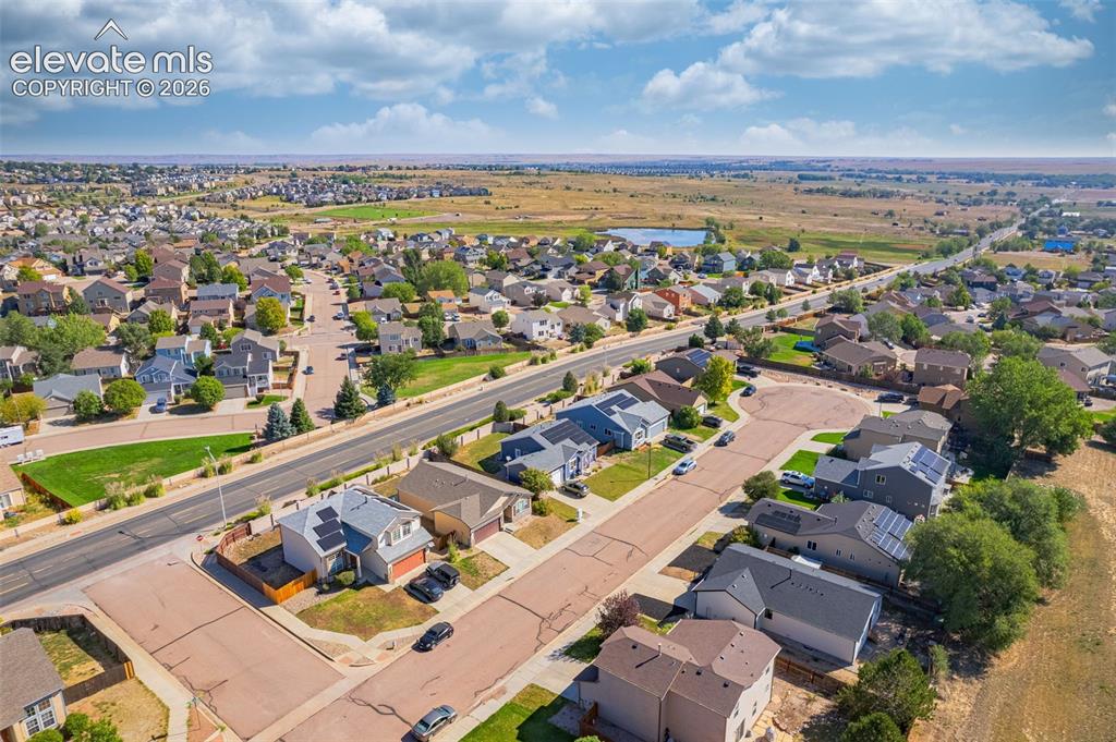 Image 33 of 37: Residential neighborhood with diverse home styles, paved roads, and organiz