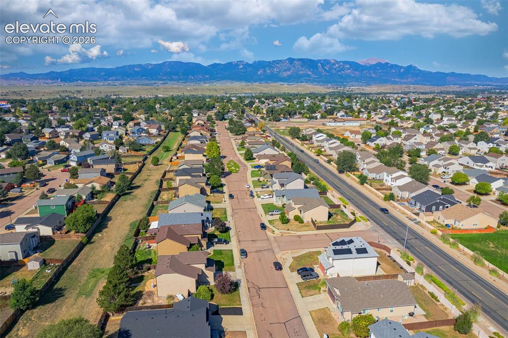 Image 35 of 37: Expansive residential area with a mountain backdrop