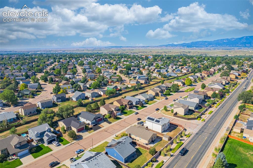 Image 36 of 37: Aerial perspective showcasing a residential neighborhood with established h