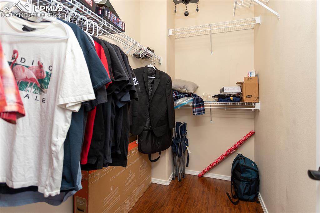 Image 27 of 49: Primary walk in closet