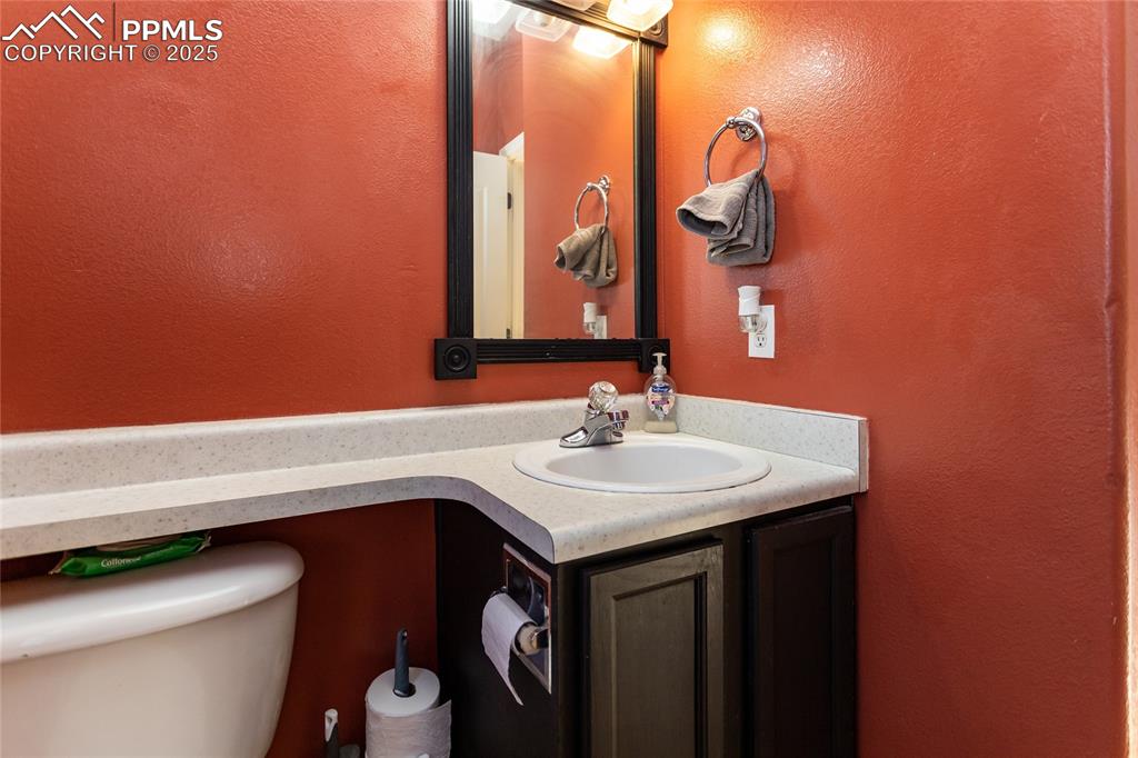 Image 43 of 49: Main level half bathroom