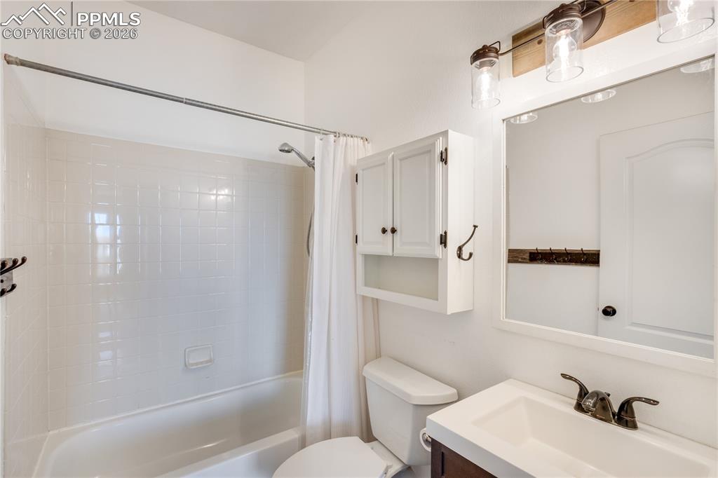 Image 19 of 39: Full bathroom with vanity and shower / bath combo