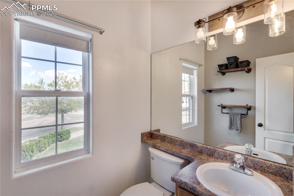 Image 6 of 39: Bathroom with vanity and toilet