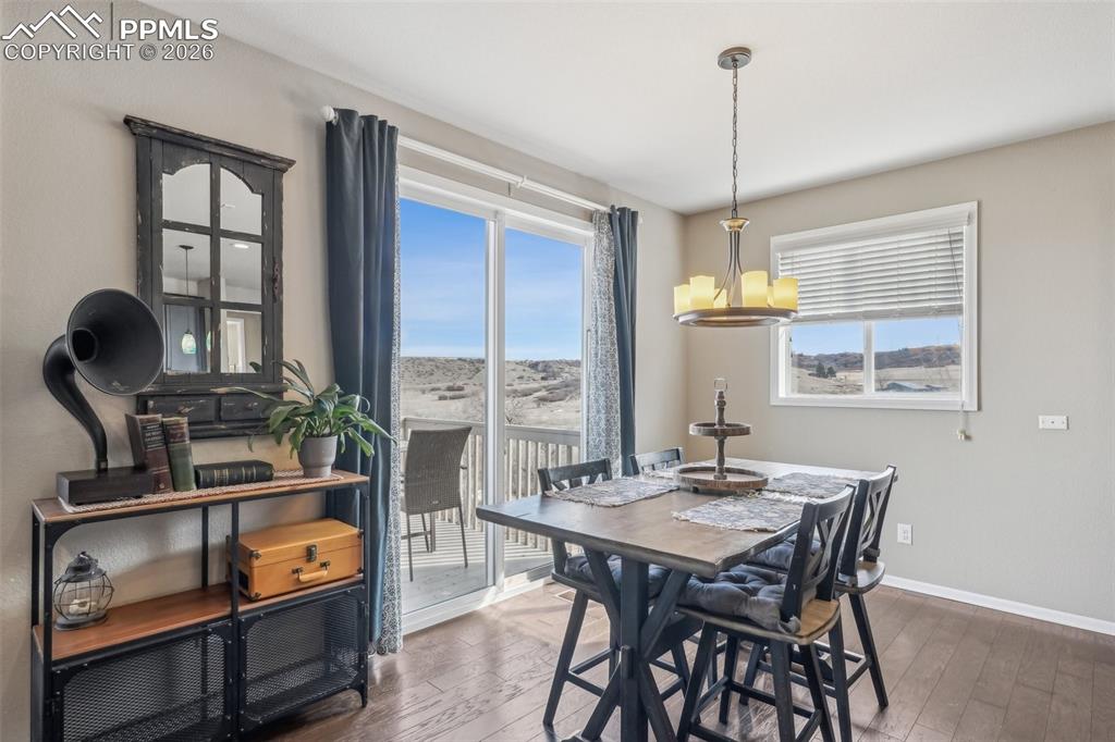 Image 12 of 50: Kitchen eating  area featuring views of open space and loads of  natural li