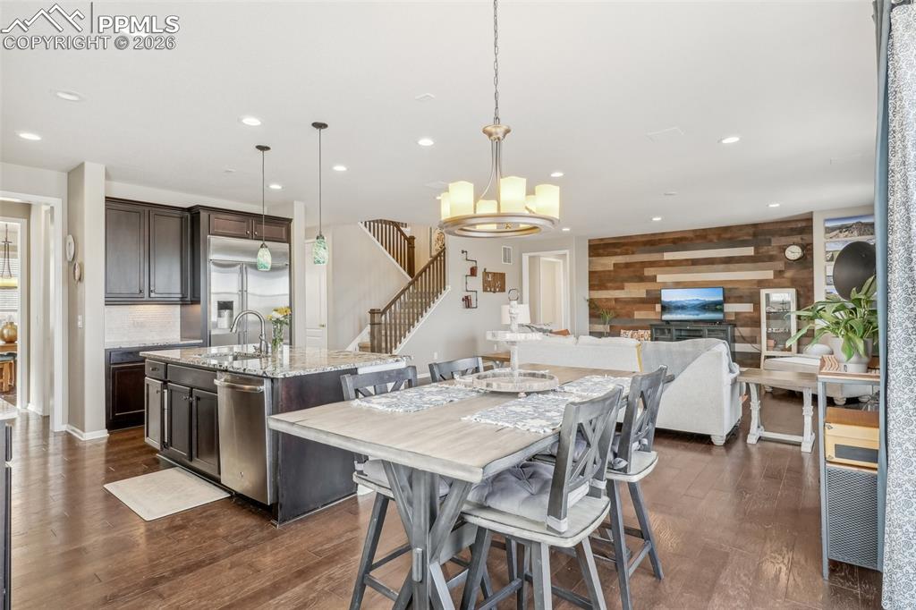 Image 14 of 50: Kitchen eating area open to great room