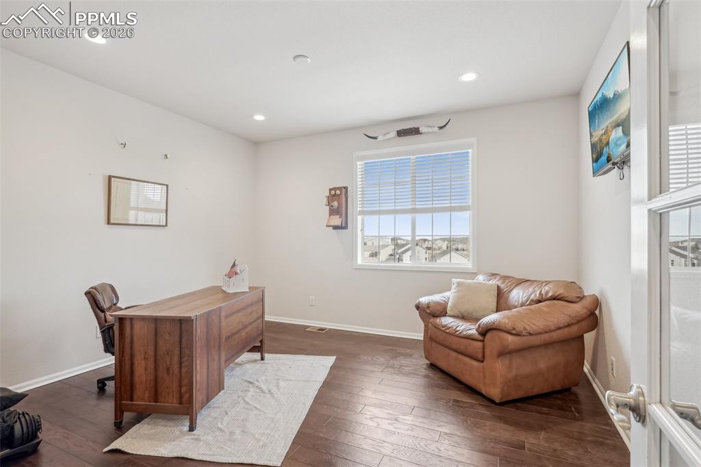 Image 19 of 50: Private office with hardwoods, french doors and views!