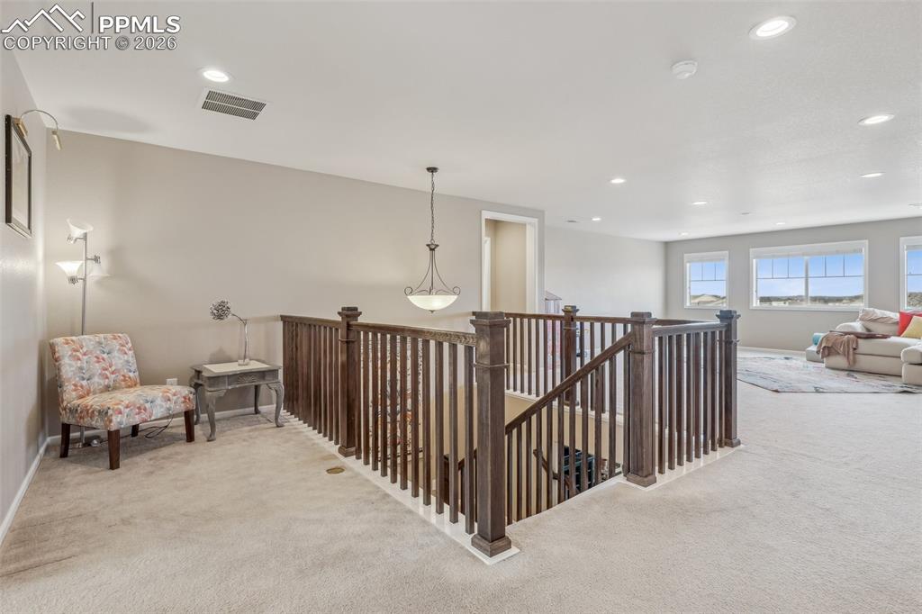 Image 22 of 50: Loft area with mini loft on left and huge family room loft/flex space on th