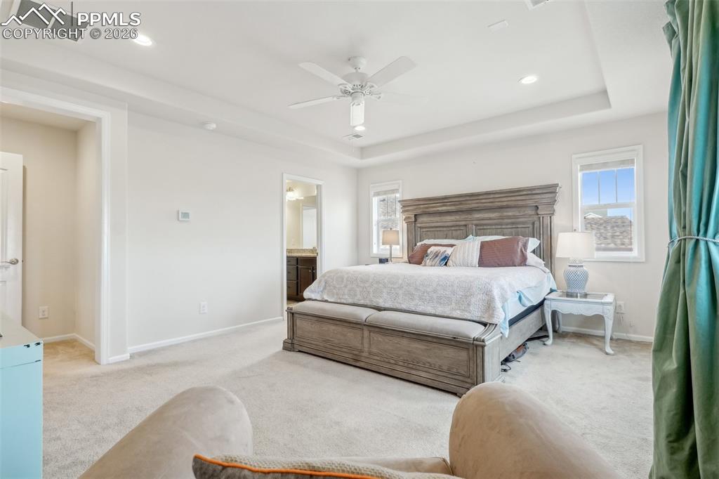 Image 26 of 50: Recessed lighting Primary suite again with views from rear facing windows