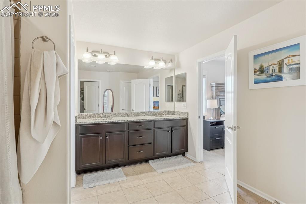 Image 29 of 50: 3/4 bathroom with double vanity.