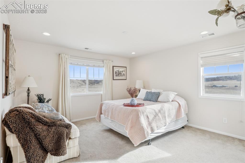 Image 30 of 50: Bedroom 2 with en suite 3/4 bath