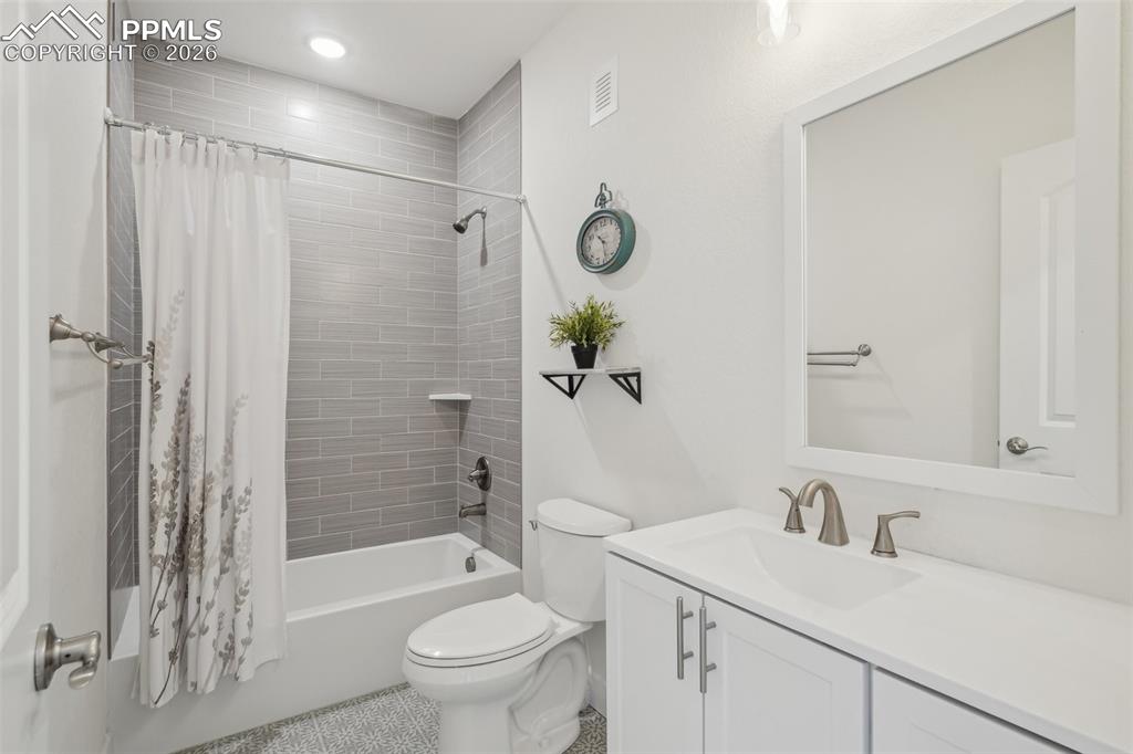 Image 43 of 50: Full bath in basement bath - professionally finished.