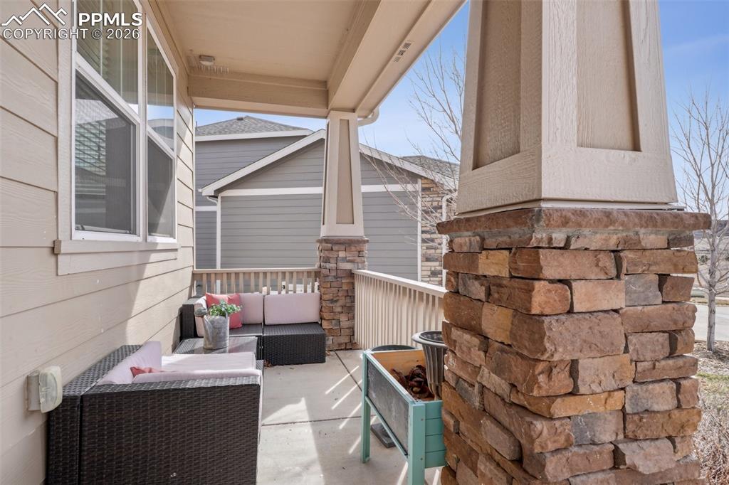 Image 44 of 50: View of patio with an outdoor hangout area and a porch