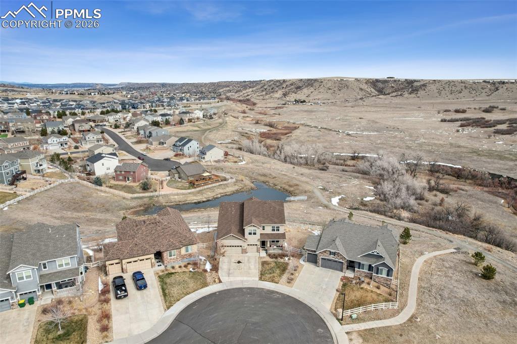 Image 48 of 50: Aerial view of property and surrounding area featuring nearby suburban area