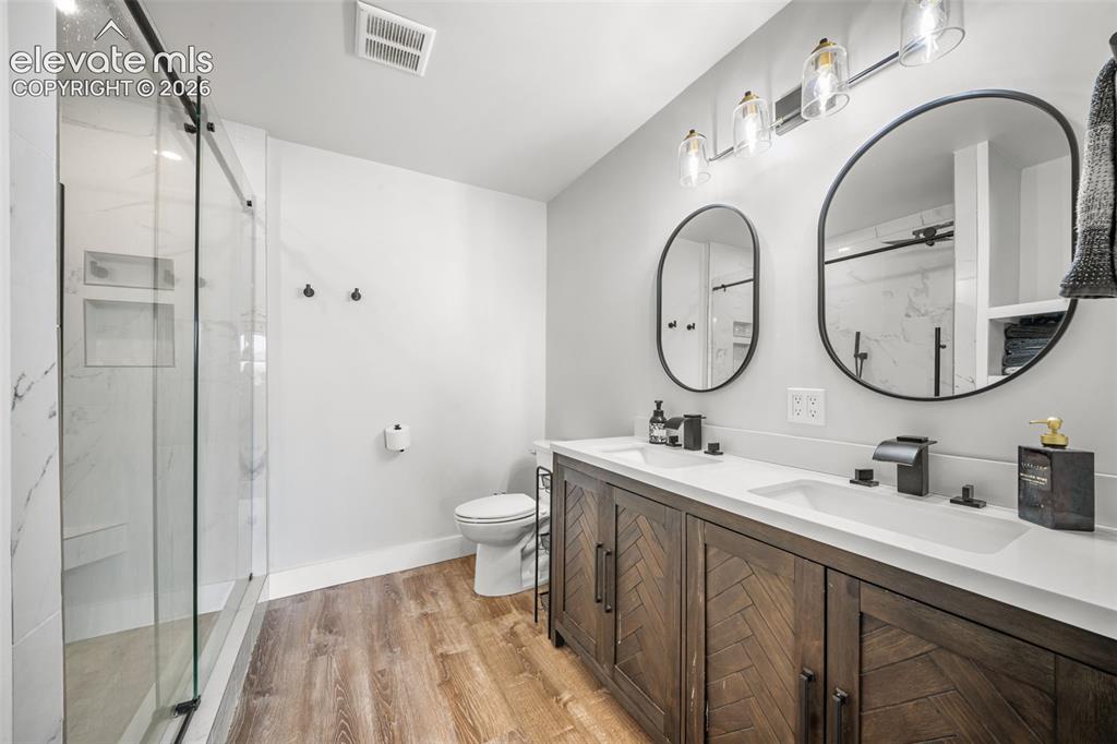Image 16 of 50: Stylish primary ensuite with dual sinks