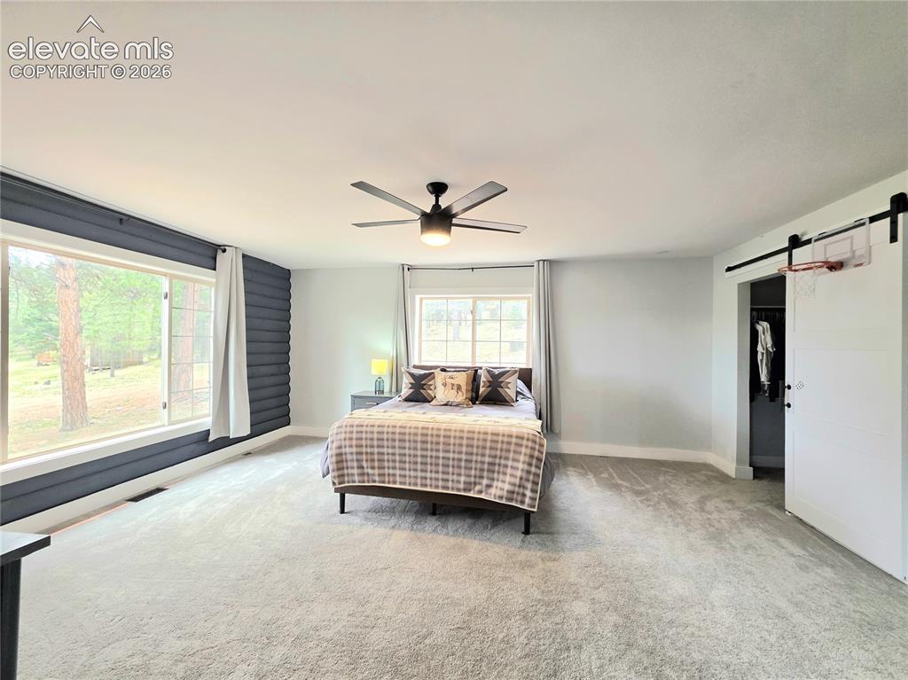 Image 19 of 50: 2nd bed is large, has great views, WIC and ensuite bath