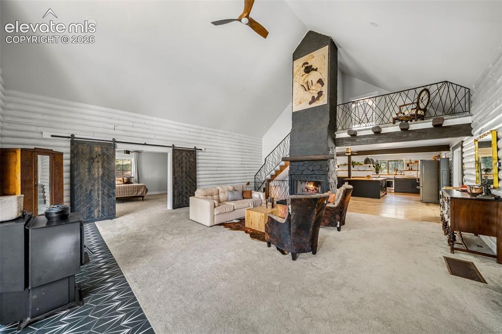 Image 2 of 50: incredible space with massive hearth and fireplace is ready for large gath