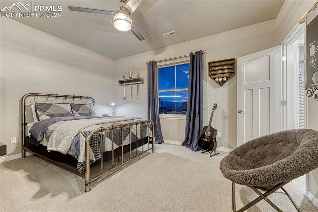 Image 23 of 48: Upstairs bedroom with mountain views