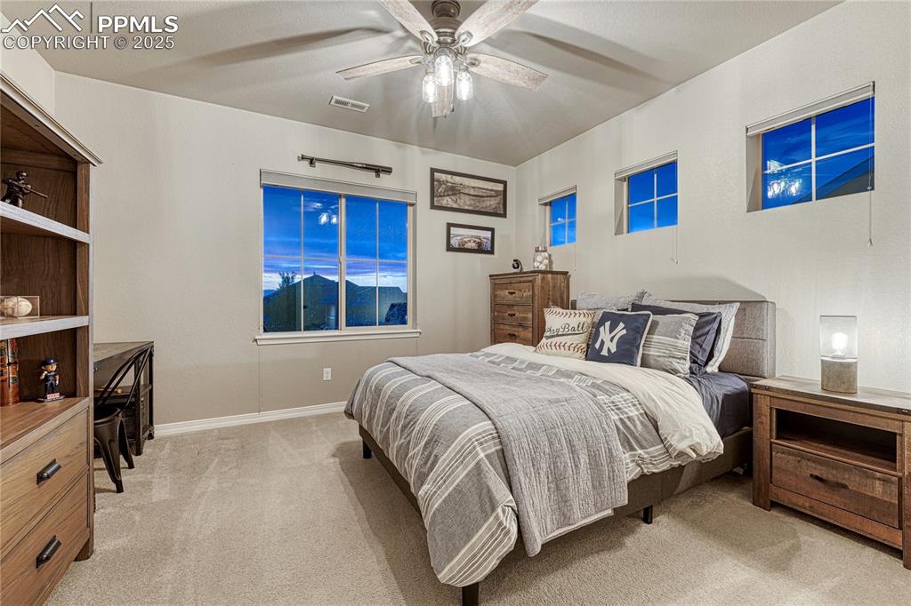 Image 25 of 48: Upstairs bedroom with mountain views