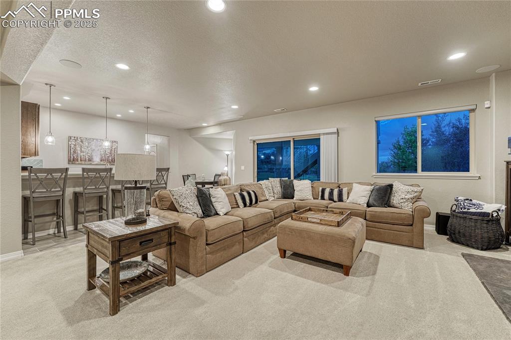 Image 30 of 48: Family room wet bar, and easy access to the outdoor patio! 
