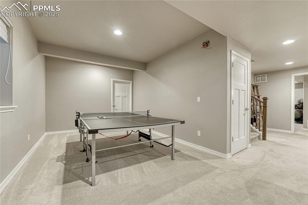 Image 32 of 48: Gaming area, right next to the family room and fireplace! 