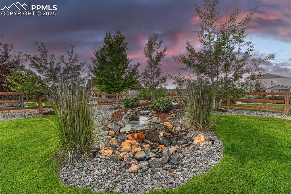 Image 41 of 48: Tranquil water feature - inside the fully fenced in back yard. 
