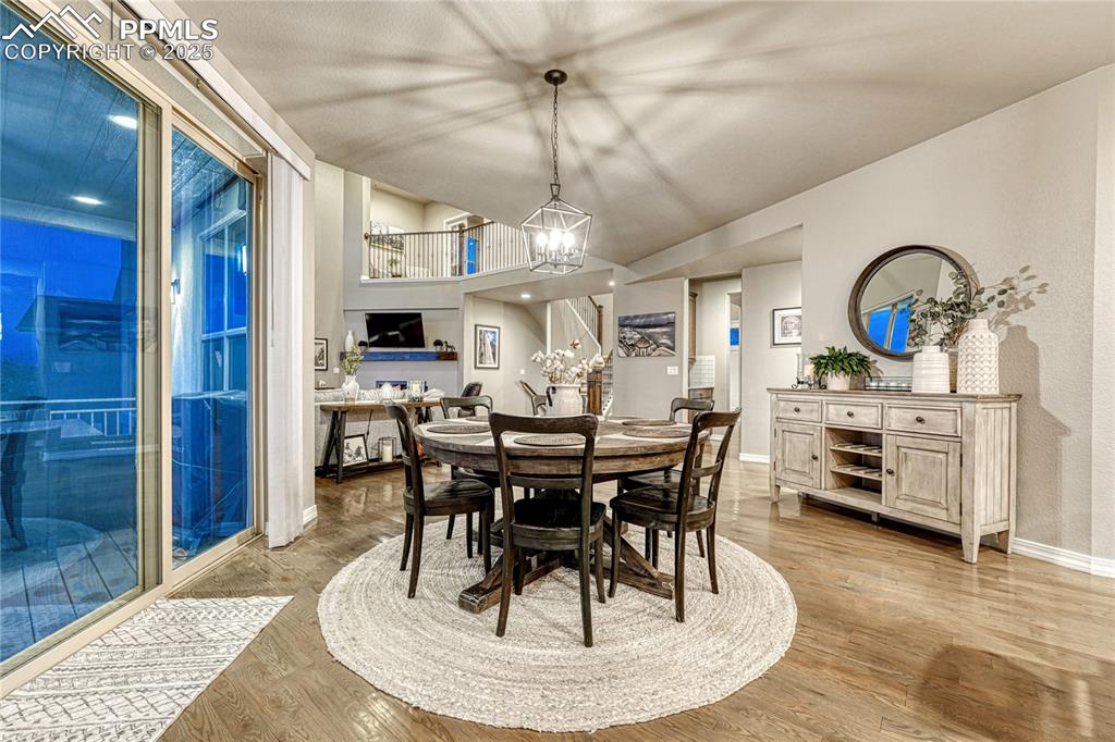 Image 5 of 48: Dining area flows seamlessly to the outdoor covered deck