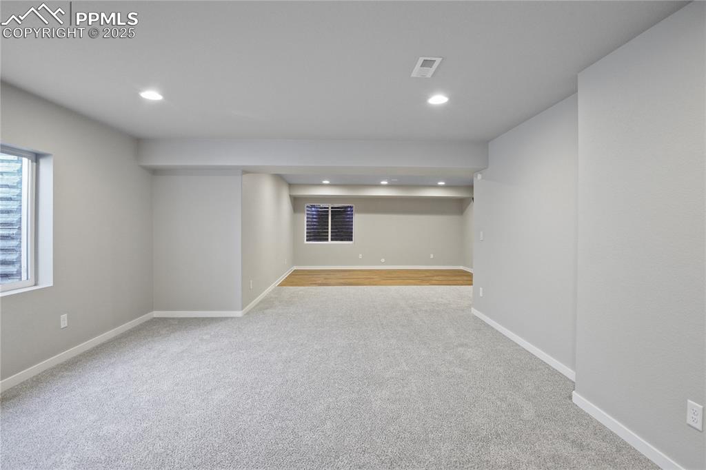 Image 40 of 50: Below grade area featuring carpet, recessed lighting, and baseboards