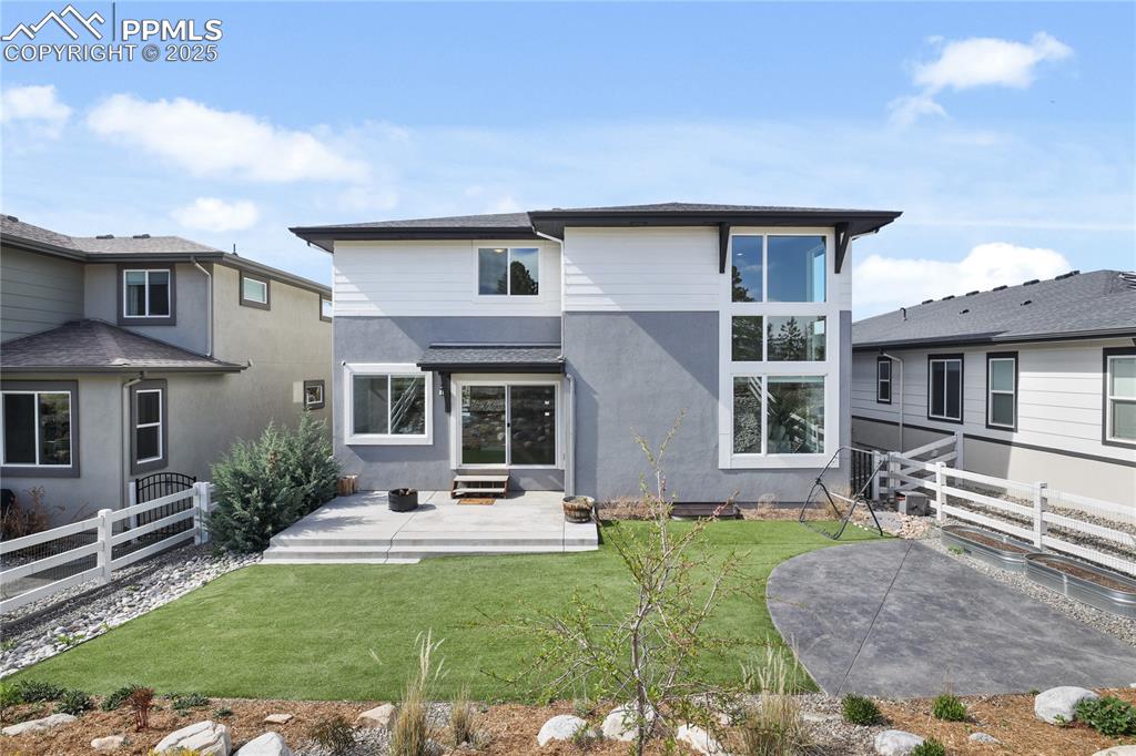 Image 45 of 50: Back of property featuring a patio and stucco siding