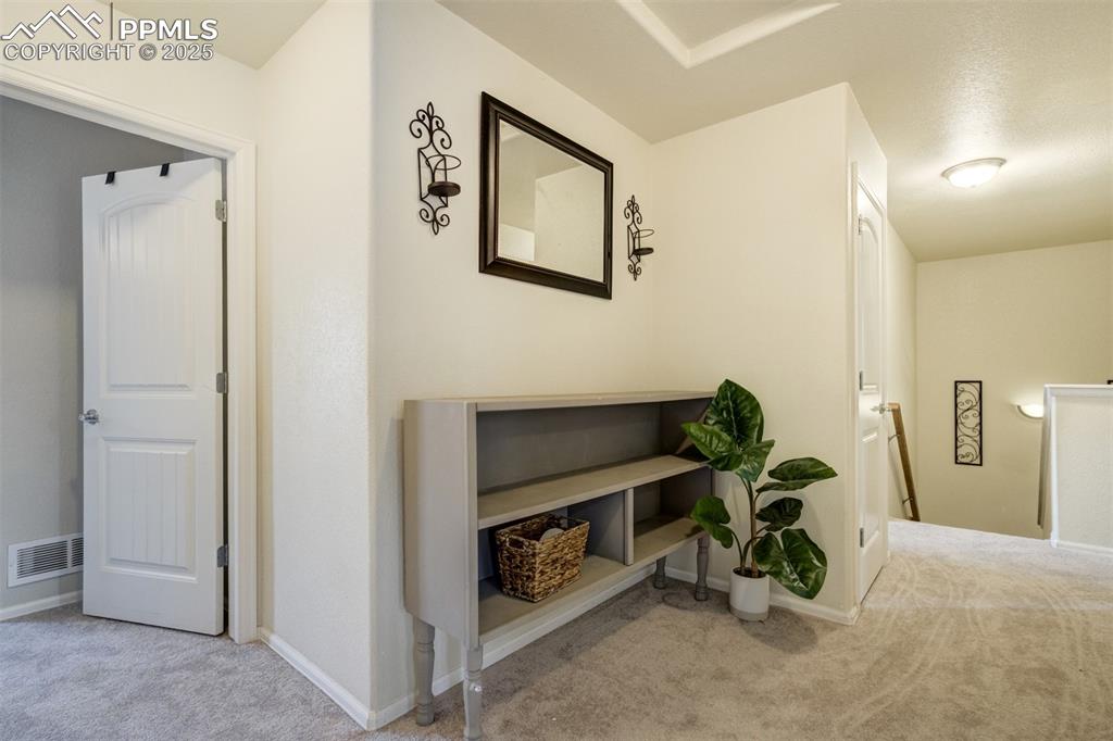 Image 13 of 28: Landing area upstairs is spacious. 