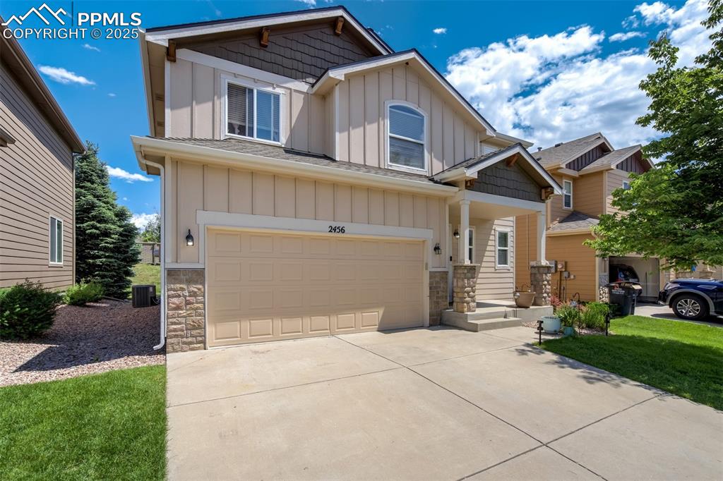 Image 28 of 28: Long driveway for the attached 2 car garage. 