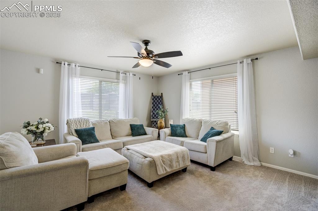 Image 4 of 28: Living room is spacious & cozy. 